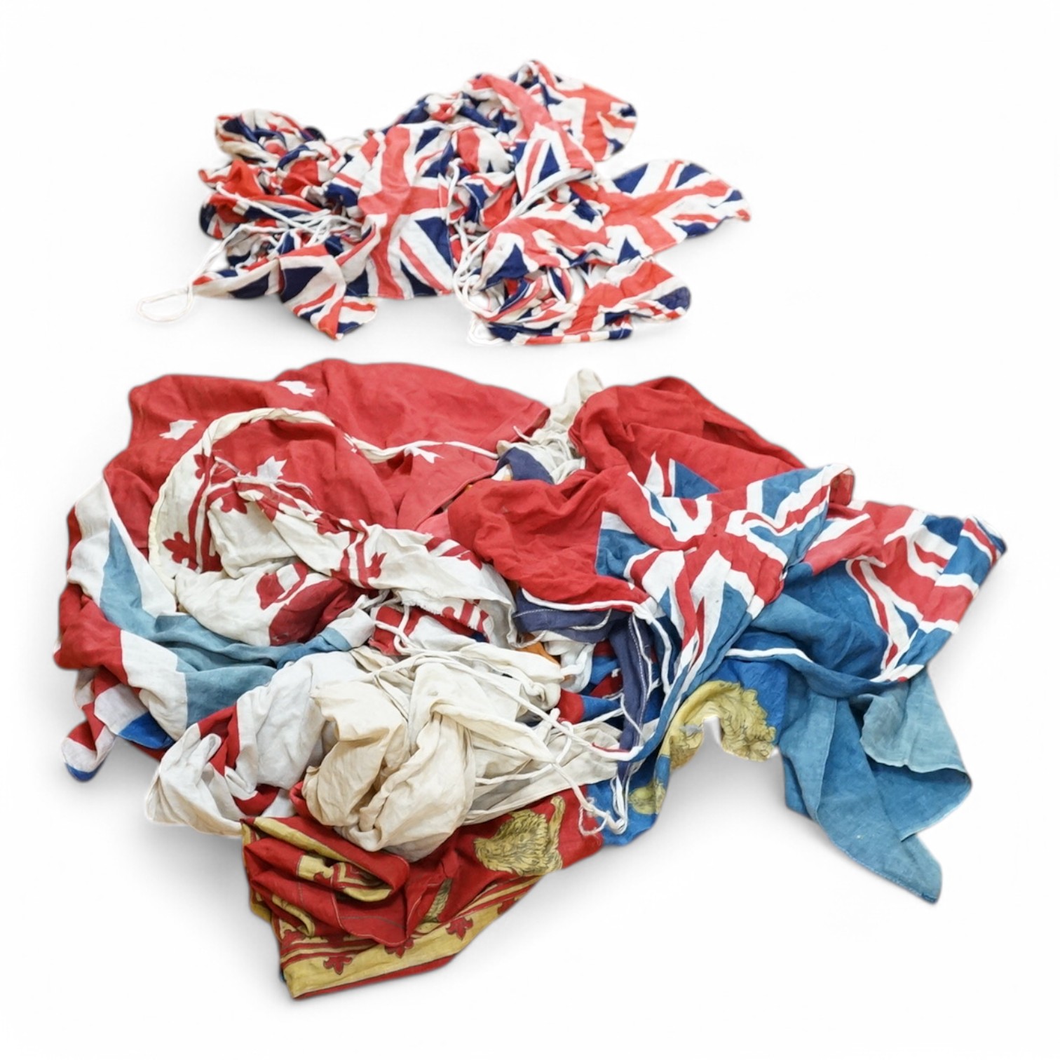 Two early 20th century strands of British patriotic bunting, one comprising 17 flags including the union flag, the British Empire South African flag, Canada flag (1892-1965), Australian Red Ensign, etc., together with a